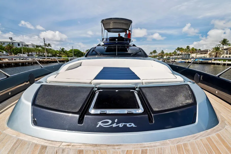 Slide: The Image of 2020 Riva 66' Ribelle luxury yacht docked in a marina. - 9
