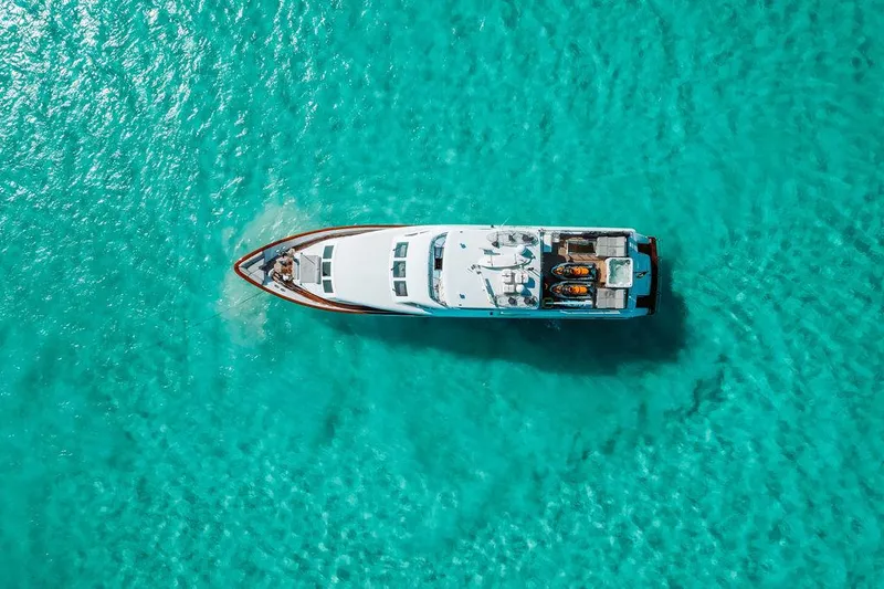 Slide: The Image of Aerial view of a 2006 Hargrave Motor Yacht on clear turquoise water. - 11
