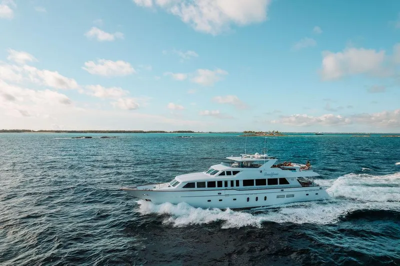 Slide: The Image of 2006 Hargrave Motor Yacht cruising on open blue waters under a clear sky. - 12