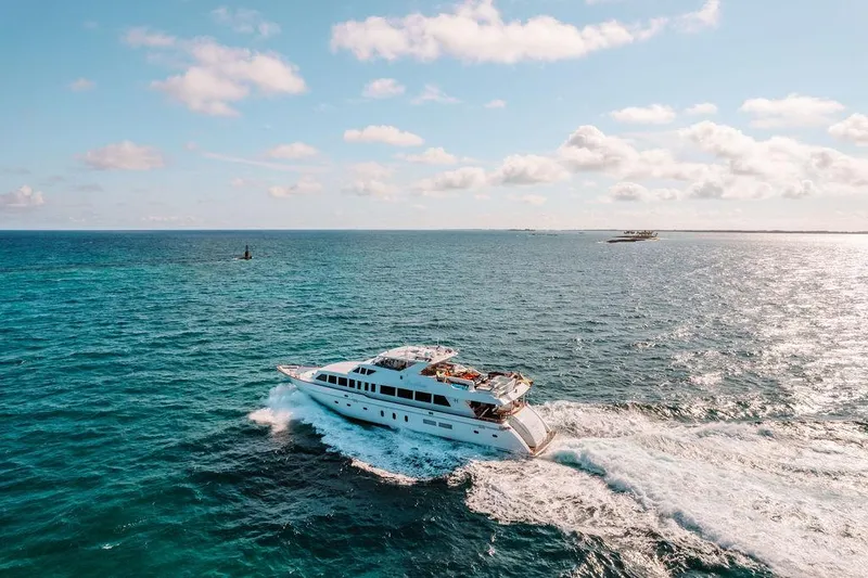 Slide: The Image of Hargrave 2006 Motor Yacht cruising on open blue ocean under a sunny sky. - 19