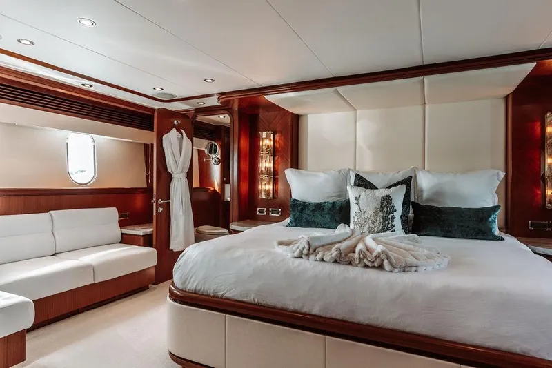 Slide: The Image of Luxurious master bedroom on a 2006 Hargrave Motor Yacht with elegant decor. - 24