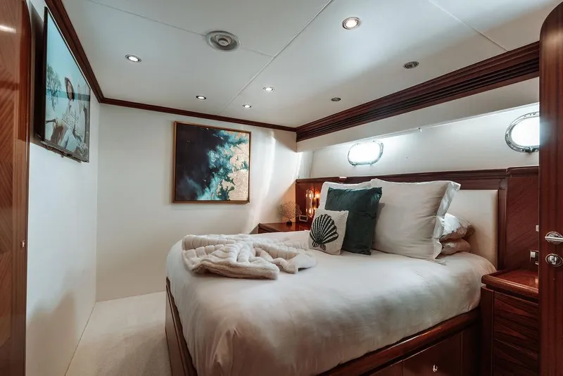 Slide: The Image of Luxurious bedroom on a 2006 Hargrave Motor Yacht with modern decor and cozy bedding. - 26