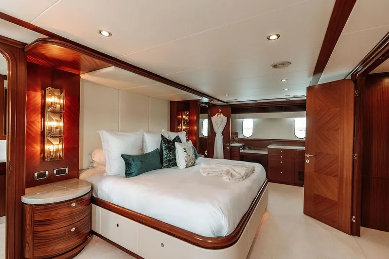 Slide: The Image of Luxurious bedroom in a 2006 Hargrave Motor Yacht with elegant wood finishes. - 28