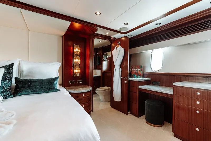Slide: The Image of Luxurious bedroom on a 2006 Hargrave Motor Yacht with elegant wood finishes and modern amenities. - 32