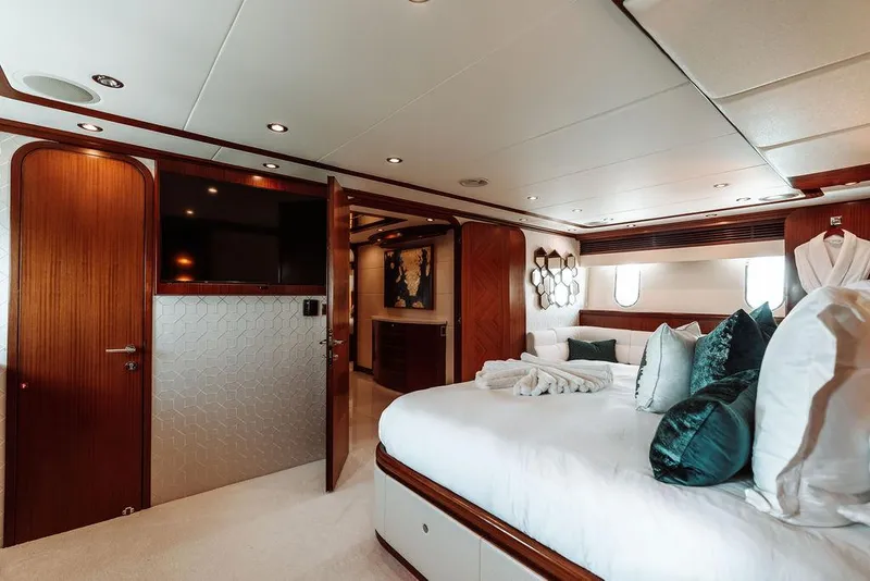 Slide: The Image of Luxurious bedroom in a 2006 Hargrave Motor Yacht with elegant wood finishes. - 34