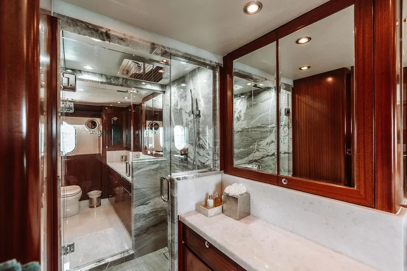 Slide: The Image of Luxurious bathroom in a 2006 Hargrave Motor Yacht with marble and wood finishes. - 36