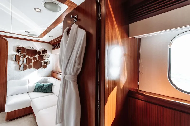 Slide: The Image of Luxurious interior of 2006 Hargrave Motor Yacht with white sofa and robe. - 39