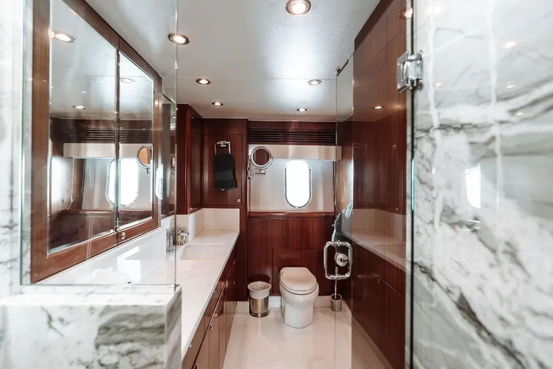 Slide: The Image of Luxurious bathroom on a 2006 Hargrave Motor Yacht with marble and wood finishes. - 40