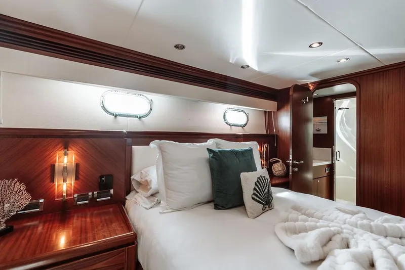 Slide: The Image of Luxurious bedroom in a 2006 Hargrave Motor Yacht with elegant wood finishes. - 42