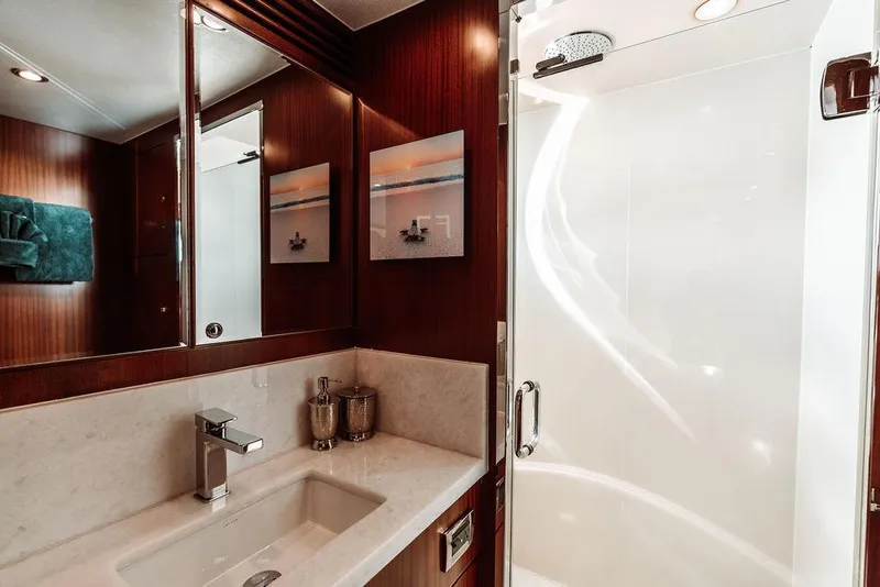 Slide: The Image of Luxurious bathroom in a 2006 Hargrave Motor Yacht with modern fixtures and elegant design. - 44