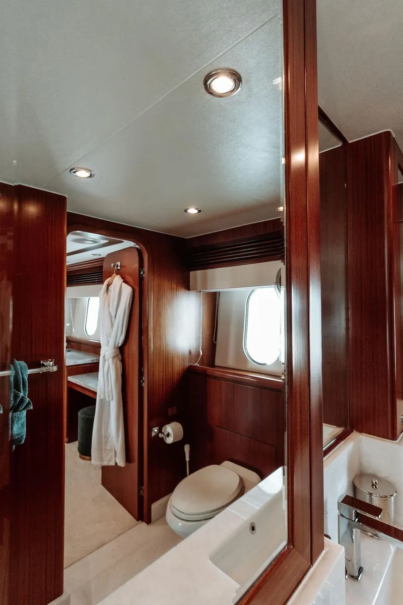 Slide: The Image of Luxurious bathroom on a 2006 Hargrave Motor Yacht with wooden finishes and modern fixtures. - 49