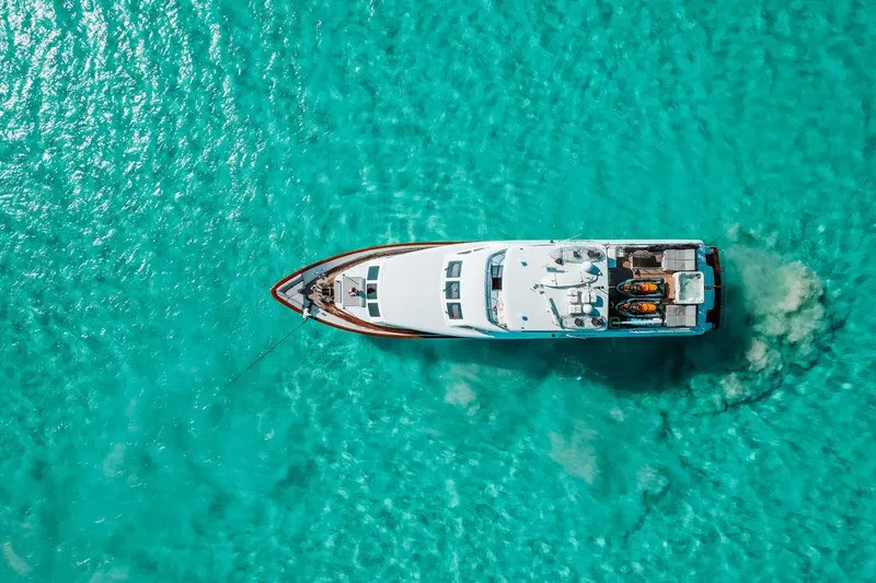 Slide: The Image of Aerial view of a 2006 Hargrave Motor Yacht on turquoise waters. - 5