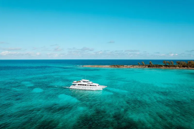 Slide: The Image of 2006 Hargrave Motor Yacht cruising in clear turquoise waters. - 9