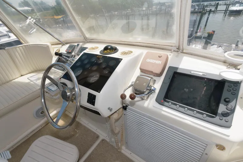 Slide: The Image of 1994 Ocean Yachts 44 Aft Cabin Motor Yacht helm with steering wheel and navigation equipment. - 10