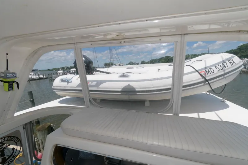 Slide: The Image of 1994 Ocean Yachts 44 Aft Cabin Motor Yacht with dinghy on deck. - 11