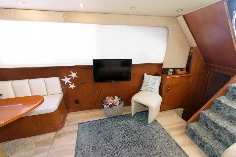 Slide: The Image of Interior of 1994 Ocean Yachts 44 Aft Cabin Motor Yacht with TV, seating, and decor. - 14