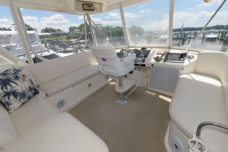Slide: The Image of 1994 Ocean Yachts 44 Aft Cabin Motor Yacht helm with panoramic marina view. - 8