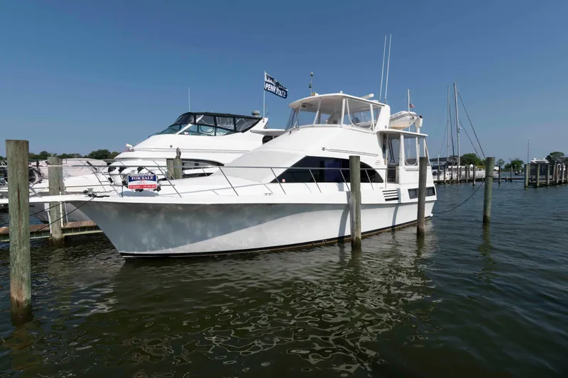 Slide: The Image of 1994 Ocean Yachts 44 Aft Cabin Motor Yacht docked, for sale sign visible. - 1