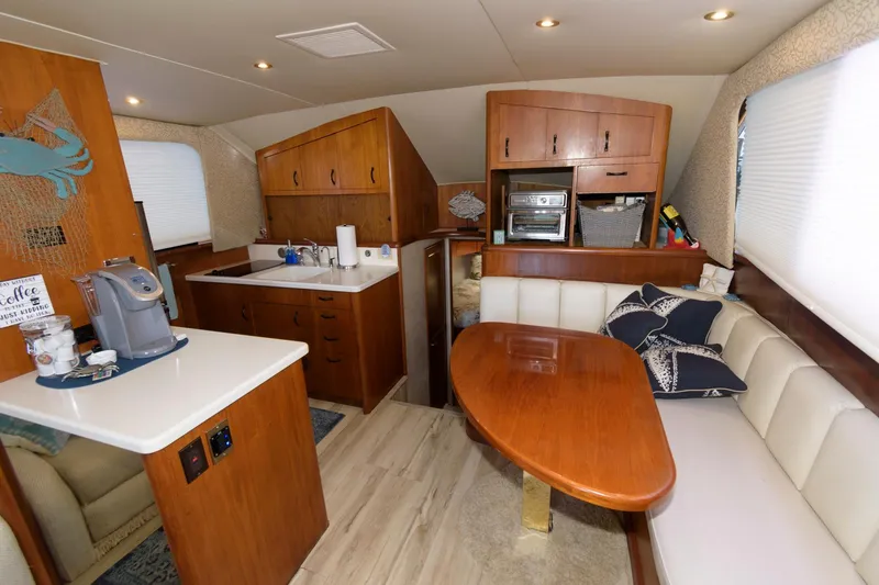Slide: The Image of 1994 Ocean Yachts 44 Aft Cabin Motor Yacht interior with kitchen and dining area. - 18