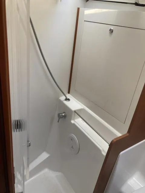 Slide: The Image of Beneteau Oceanis 45 2014 model shower area with modern fixtures and storage. - 22