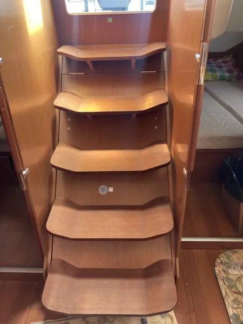 Slide: The Image of Wooden interior stairs of a 2014 Beneteau Oceanis 45 sailboat. - 23