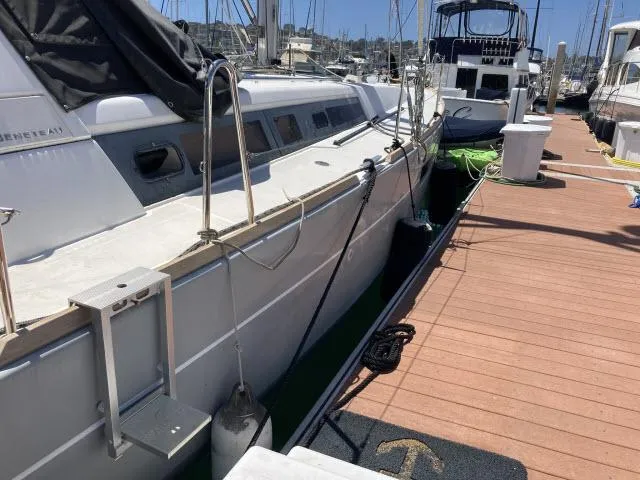 Slide: The Image of 2014 Beneteau Oceanis 45 sailboat docked at a marina. - 35