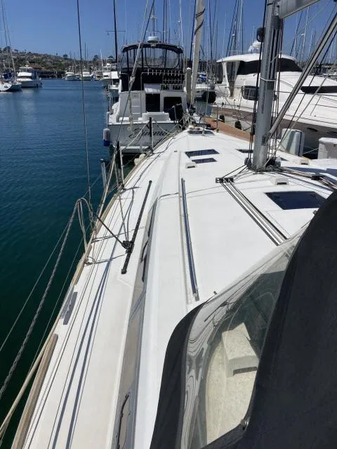 Slide: The Image of 2014 Beneteau Oceanis 45 sailboat docked in a marina. - 37