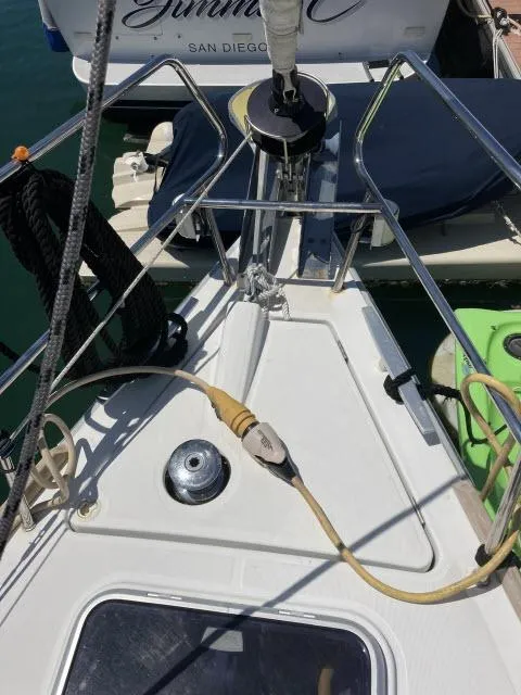 Slide: The Image of 2014 Beneteau Oceanis 45 sailboat deck with mooring lines and power cable. - 40