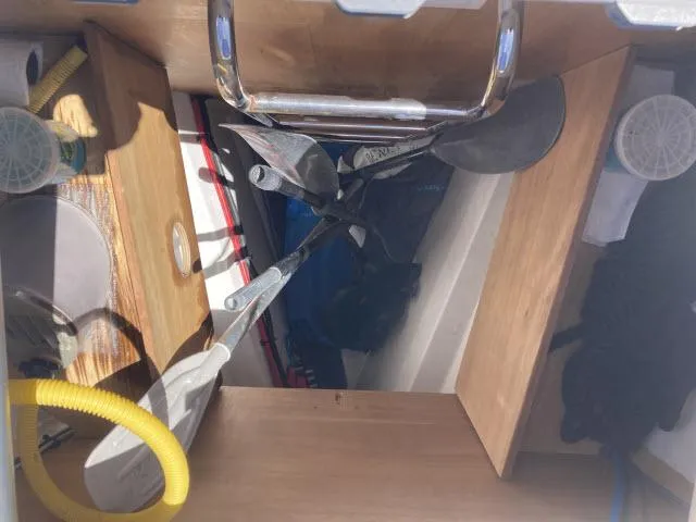 Slide: The Image of Storage compartment of a 2014 Beneteau Oceanis 45 sailboat with paddles and equipment. - 42