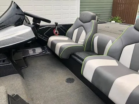 Slide: The Image of 2018 Skeeter ZX200 boat interior with gray and white seats. - 4