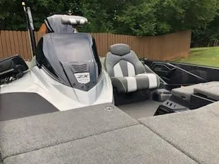 Slide: The Image of 2018 Skeeter ZX200 boat interior with gray and green seating. - 8