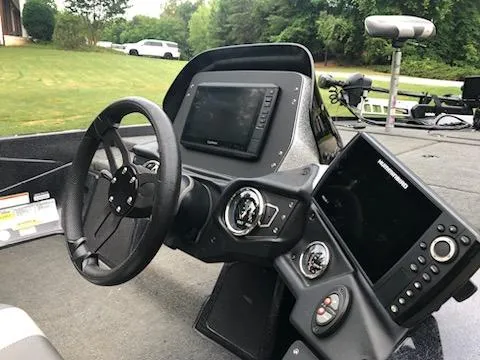 Slide: The Image of 2018 Skeeter ZX200 boat dashboard with steering wheel and electronic displays. - 9