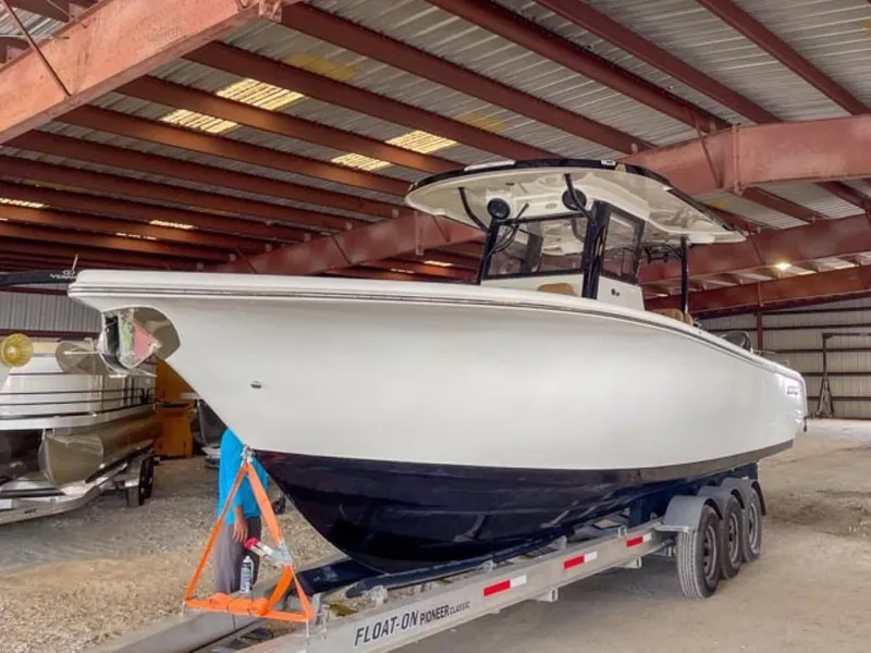 Slide: The Image of 2025 Sea Pro 322 Offshore boat on trailer in covered storage. - 1