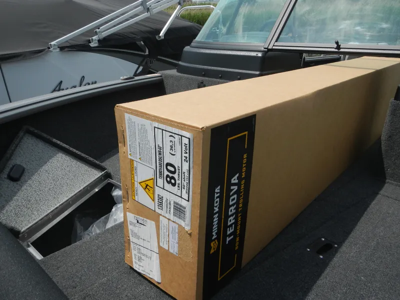 Slide: The Image of 2024 Lund 1775 Impact XS Sport boat with Minn Kota Terrova box on deck. - 5