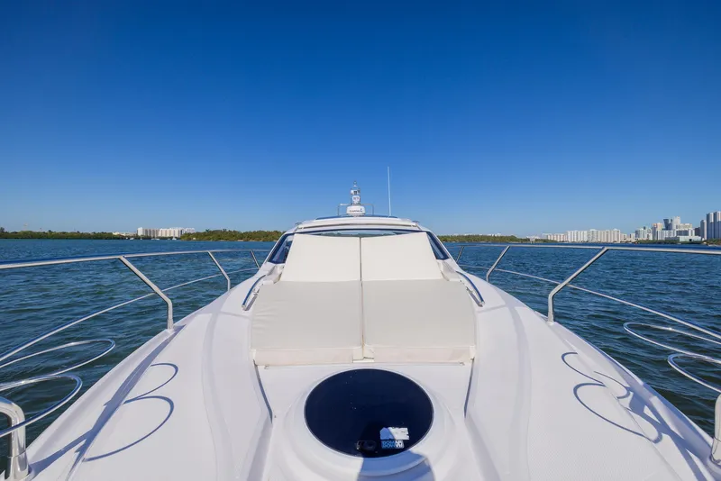 Slide: The Image of 2024 Sessa Marine C36 OB yacht on open water under clear blue sky. - 4