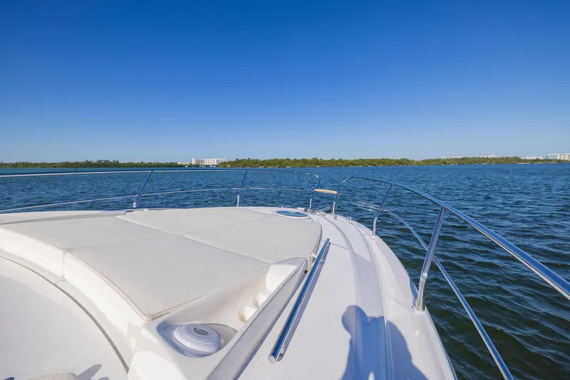 Slide: The Image of 2024 Sessa Marine C36 OB yacht on calm water under clear blue sky. - 6