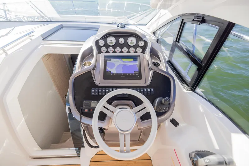 Slide: The Image of 2024 Sessa Marine C36 OB boat cockpit with modern navigation system. - 9