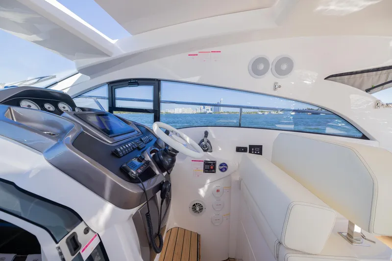 Slide: The Image of 2024 Sessa Marine C36 OB yacht cockpit with modern controls and ocean view. - 11
