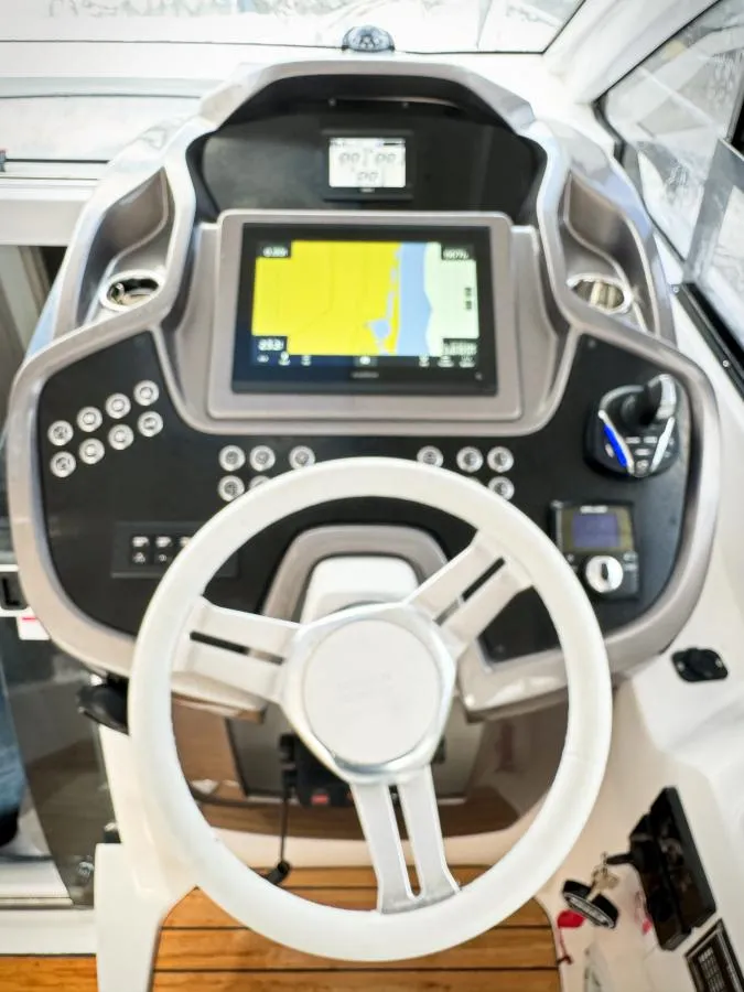 Slide: The Image of 2024 Sessa Marine C36 OB helm with advanced navigation system and controls. - 13