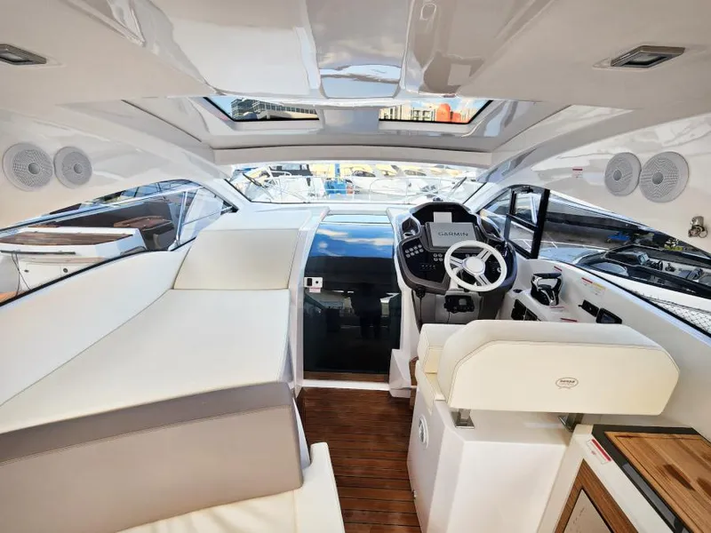 Slide: The Image of Luxurious interior of 2024 Sessa Marine C36 OB yacht with modern helm and seating. - 18
