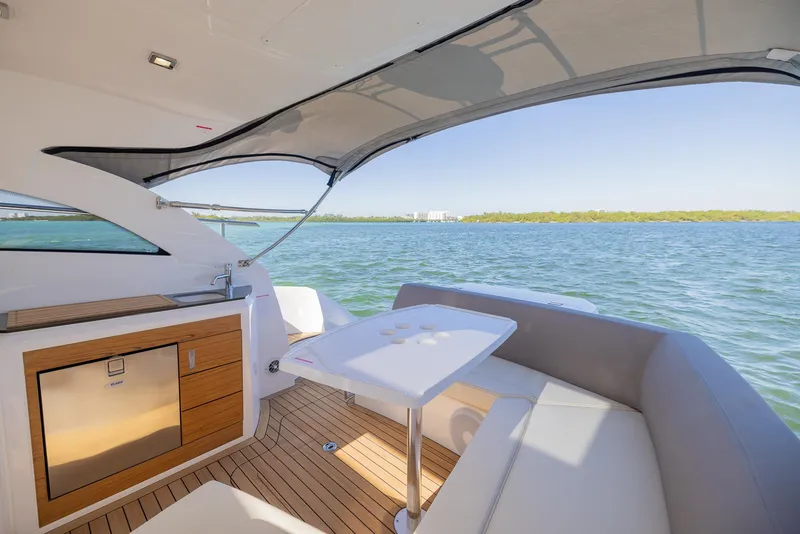 Slide: The Image of Luxurious 2024 Sessa Marine C36 OB yacht interior with seating and ocean view. - 19