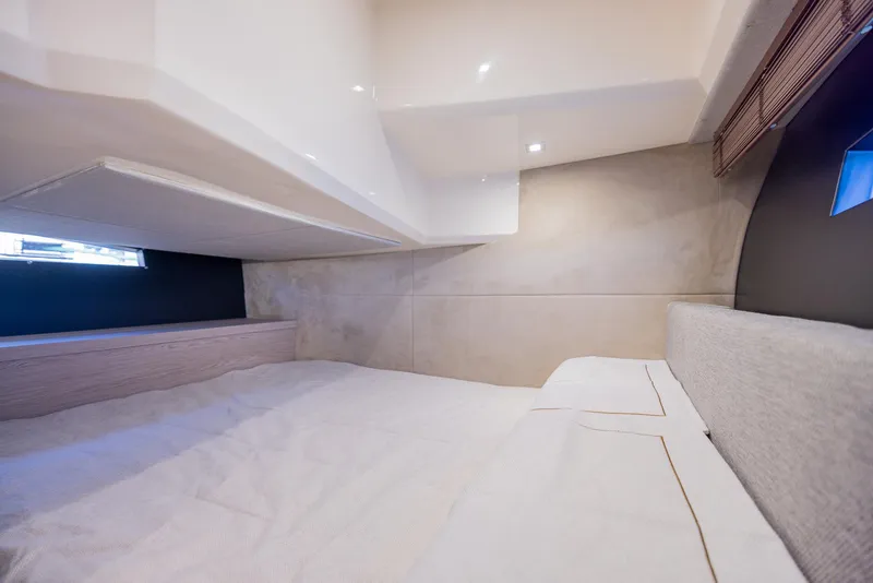 Slide: The Image of Interior cabin of 2024 Sessa Marine C36 OB, featuring modern design and cozy sleeping area. - 31