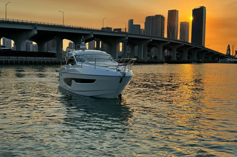 Slide: The Image of 2024 Sessa Marine C36 OB yacht at sunset near city bridge. - 4