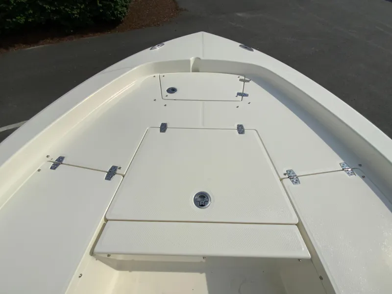 Slide: The Image of 2024 Pathfinder 2200 TRS boat deck with storage compartments. - 11
