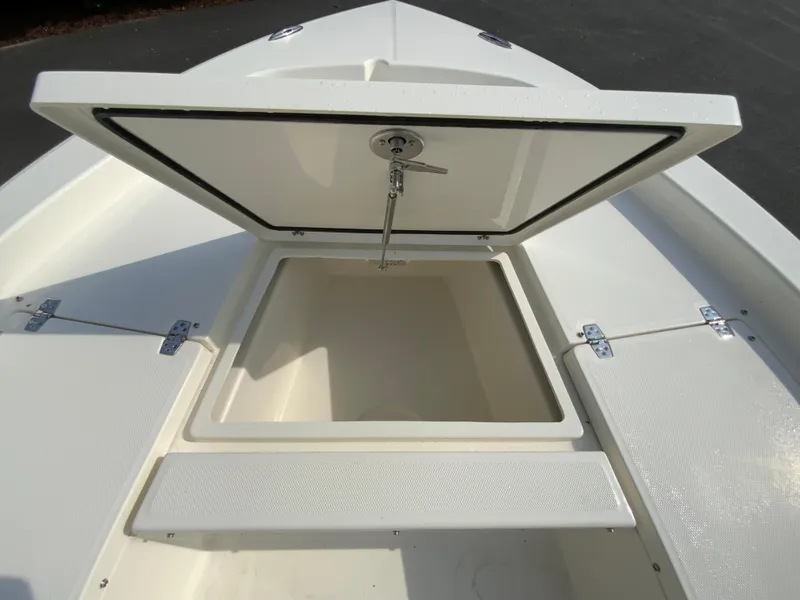 Slide: The Image of 2024 Pathfinder 2200 TRS boat storage compartment open. - 13