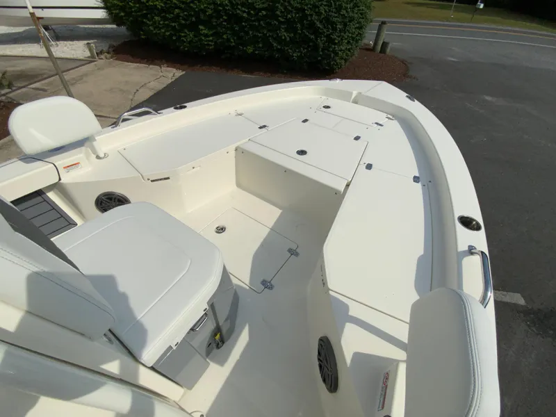 Slide: The Image of 2024 Pathfinder 2200 TRS boat interior with seating and storage compartments. - 14