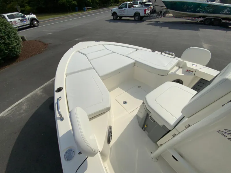 Slide: The Image of 2024 Pathfinder 2200 TRS boat interior with white cushioned seating. - 15