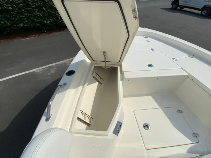 Slide: The Image of 2024 Pathfinder 2200 TRS boat with open storage compartment on deck. - 18