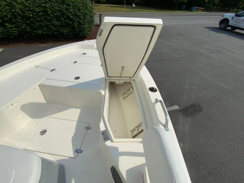 Slide: The Image of 2024 Pathfinder 2200 TRS boat with open storage compartment on deck. - 19
