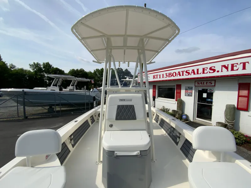 Slide: The Image of 2024 Pathfinder 2200 TRS boat with T-top at a boat dealership. - 20